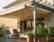 Terrasse mit Markise und Pergola als Sonnenschutz